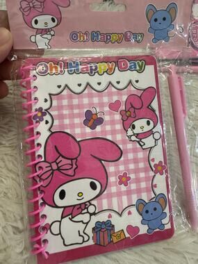 My Melody notebook with pen pink and white checkered background,